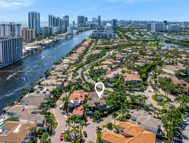 an aerial view of residential houses with city view