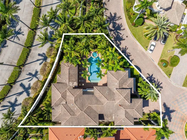 an aerial view of a house with a garden