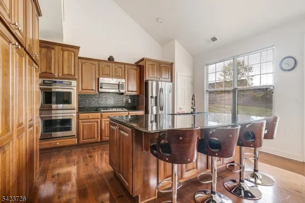 a room with furniture a rug and a chandelier