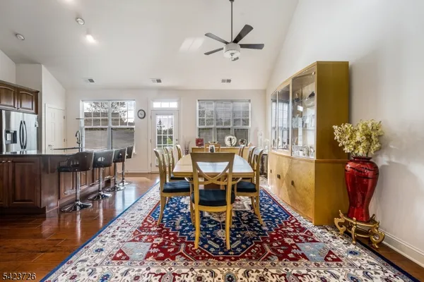 a view of a dining area with furniture and a clock