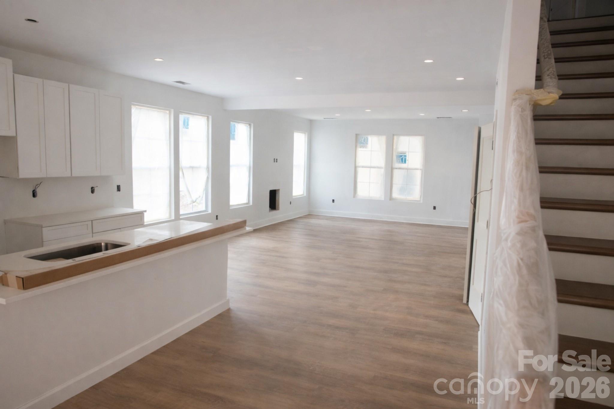 1424 Quiver Way York, SC 29745 - Photo 8 of 8 a large white kitchen with granite countertop a sink and a large window