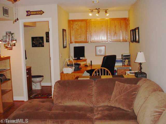 110 Harper Ridge Court Clemmons, NC 27012 - Photo 14 of 16 Den/Family/Great Room. LL Den also has a built-in desk/work space and access to half bath.