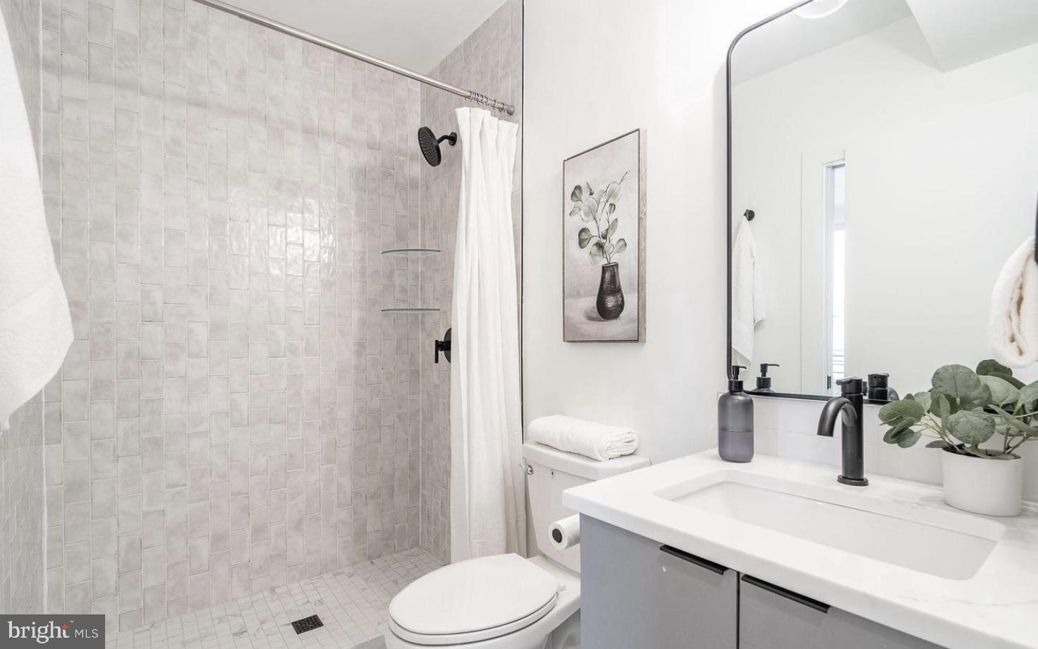 136 Q Street Northwest, Unit 2 Washington, DC 20001 - Photo 12 of 24 Full bath off of kitchen.