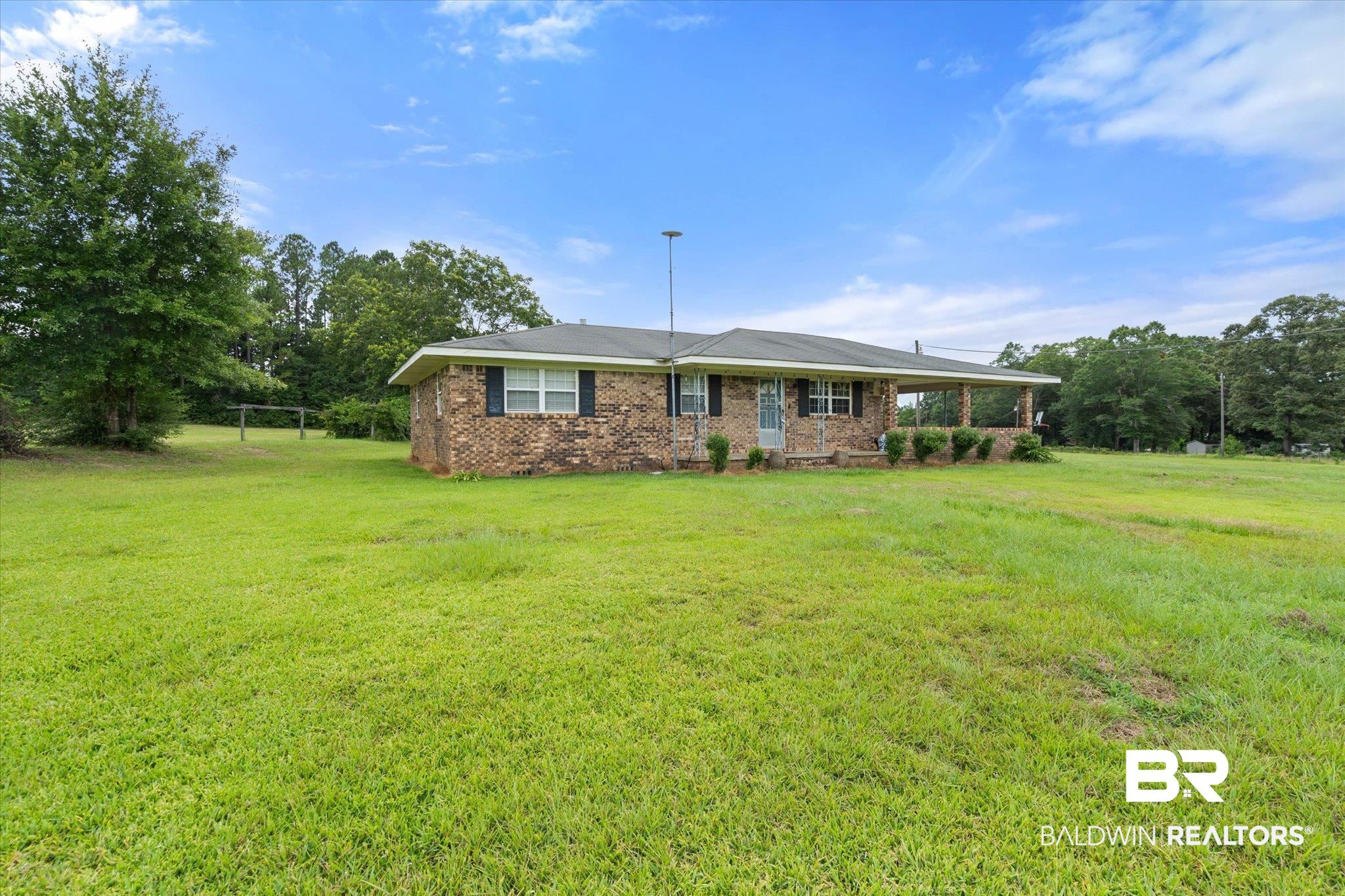 11601 Lott Road Chunchula, AL 36521 - Photo 14 of 34 View of front of home featuring a front yard and brick siding