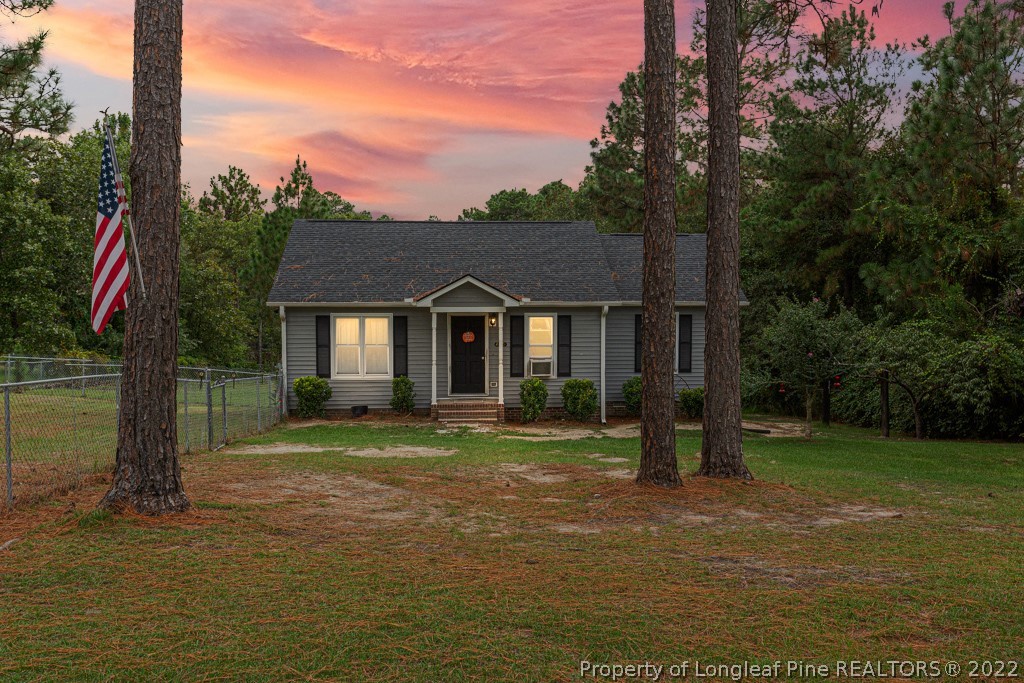 a front view of a house with a yard