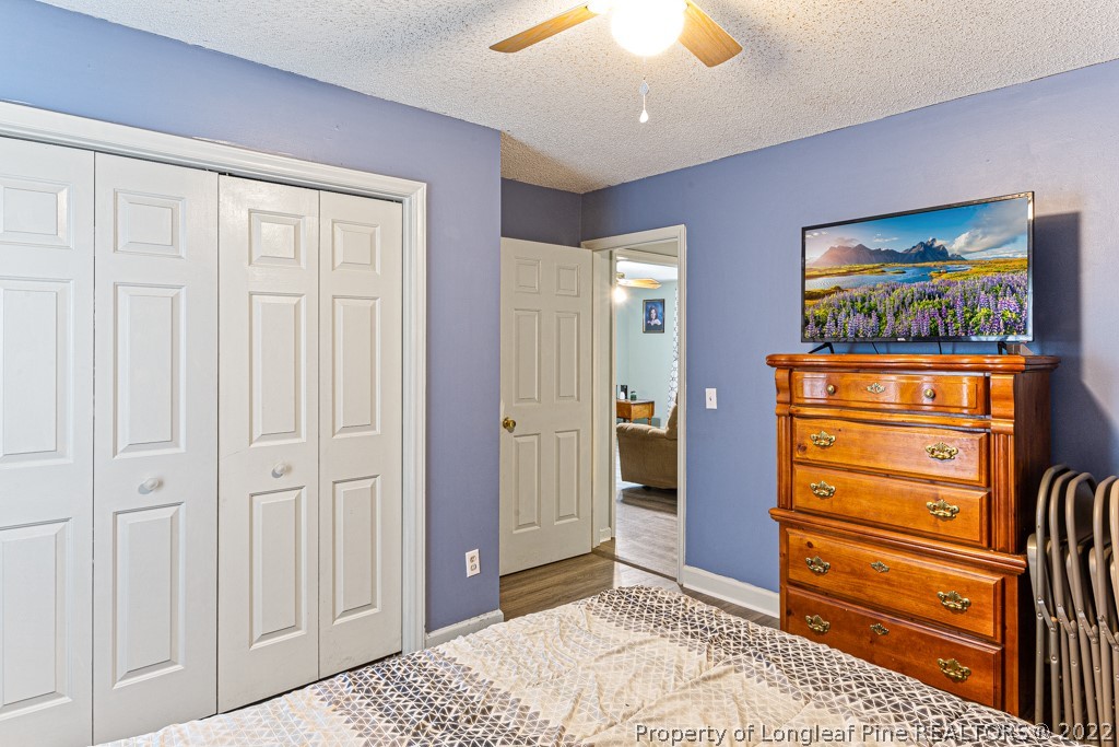 400 Evans Drive Cameron, NC 28326 - Photo 13 of 15 an empty room with closet and flat screen tv
