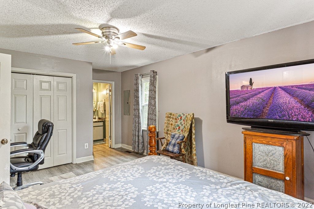 400 Evans Drive Cameron, NC 28326 - Photo 14 of 15 a bedroom with furniture and a window