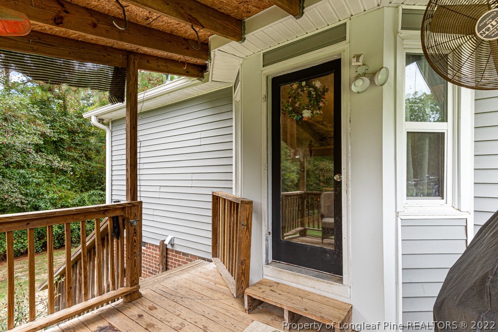 400 Evans Drive Cameron, NC 28326 - Photo 5 of 15 a view of a balcony with wooden floor