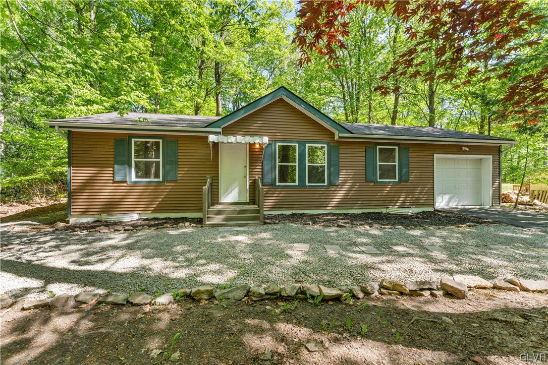 4121 Romeo Road Tobyhanna, PA 18466 - Photo 1 of 24 a view of a house with yard and a tree