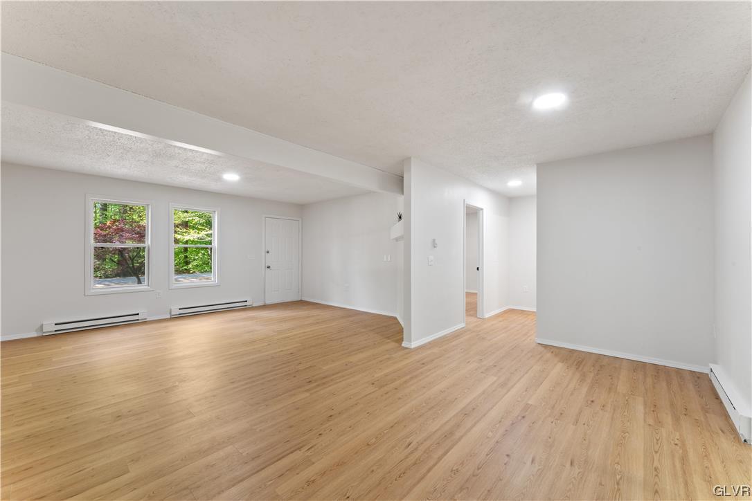 4121 Romeo Road Tobyhanna, PA 18466 - Photo 5 of 24 an empty room with wooden floor and windows