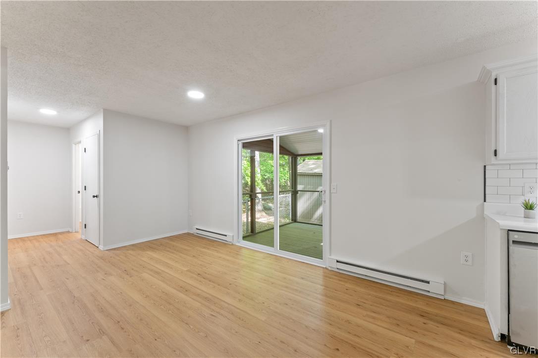 4121 Romeo Road Tobyhanna, PA 18466 - Photo 6 of 24 a view of an empty room with wooden floor and a window
