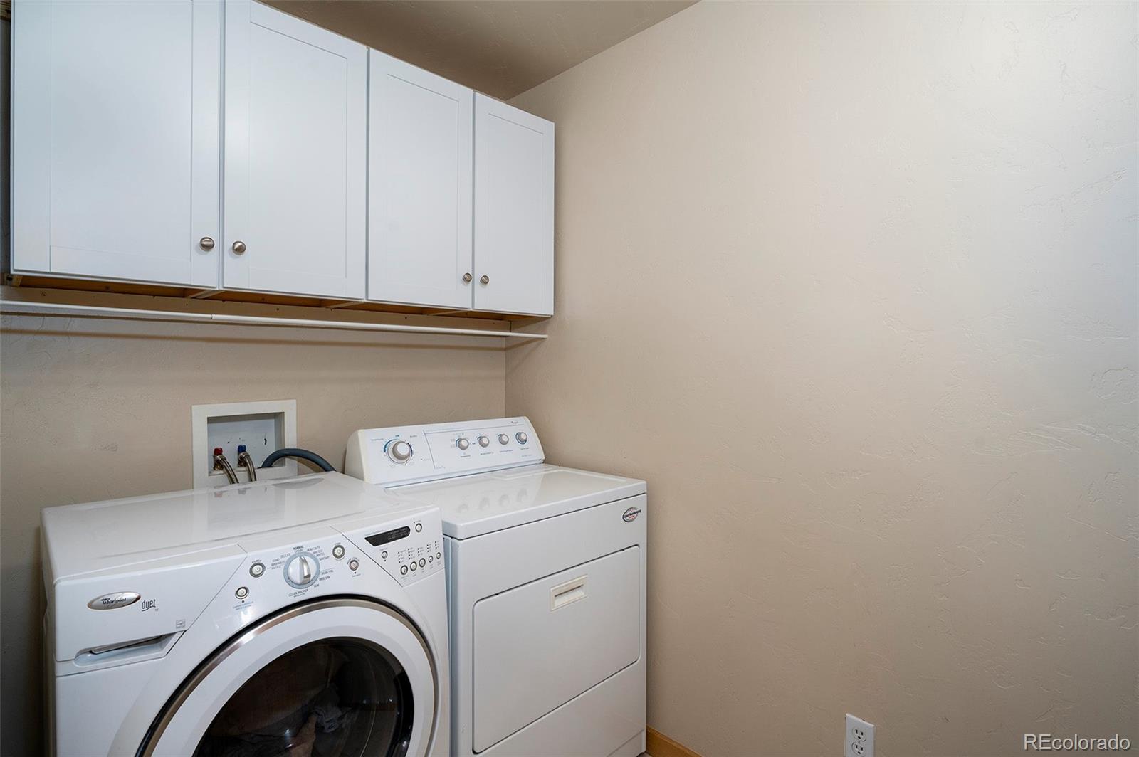 290 Village Road Granby, CO 80446 - Photo 26 of 45 a utility room with dryer and washer