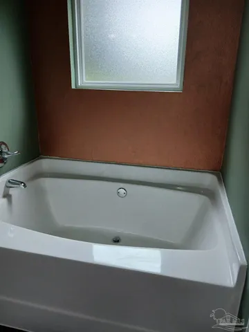 a view of a bathtub in a bathroom