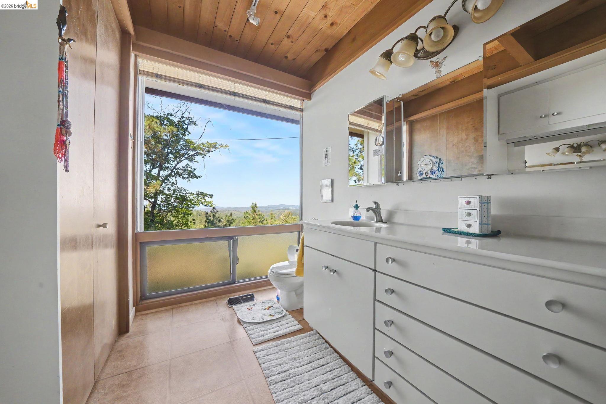 6161 Fullen Road Murphys, CA 95247 - Photo 40 of 53 a spacious bathroom with a double vanity sink and a large mirror