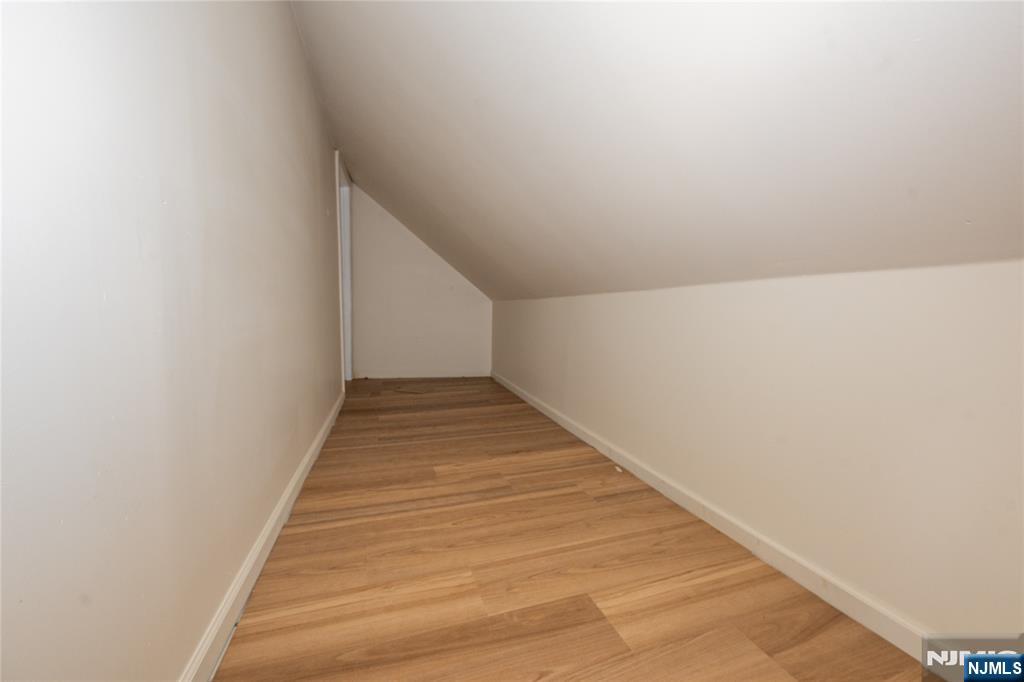 153 Augusta Street Irvington, NJ 07111 - Photo 24 of 26 a view of a hallway with wooden floor