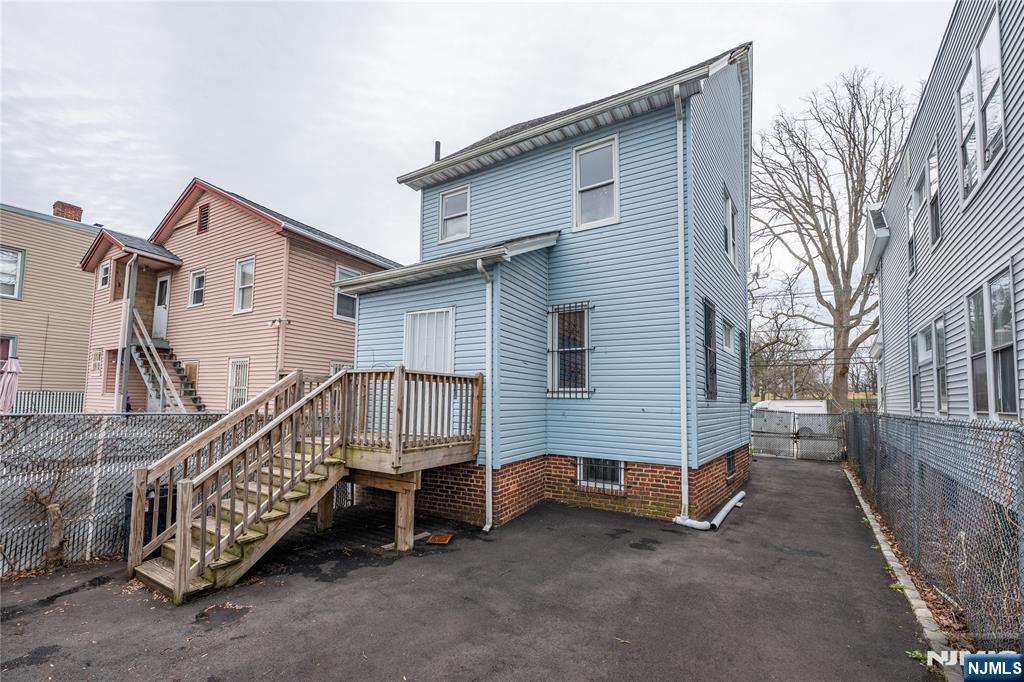 153 Augusta Street Irvington, NJ 07111 - Photo 26 of 26 a view of a house with a yard