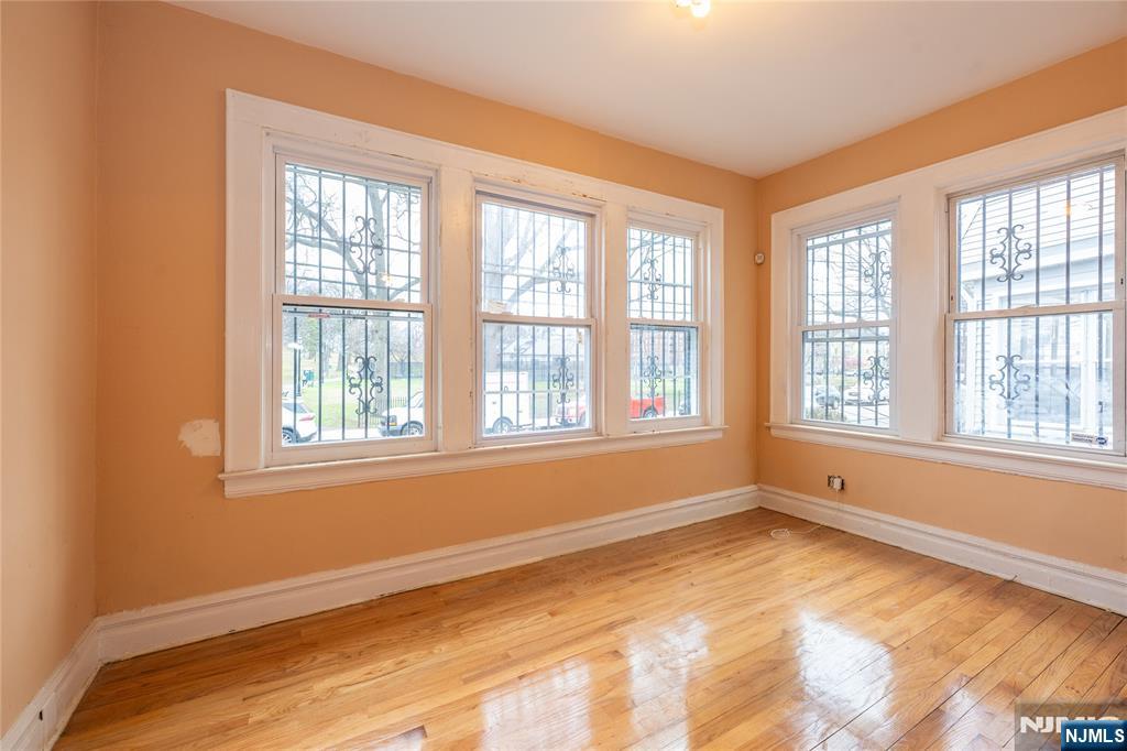 153 Augusta Street Irvington, NJ 07111 - Photo 7 of 26 a view of an empty room with a window