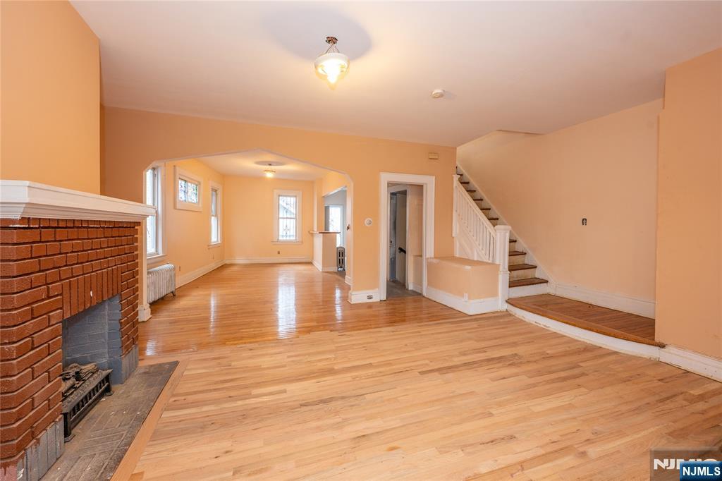 153 Augusta Street Irvington, NJ 07111 - Photo 8 of 26 a view of a room with wooden floor