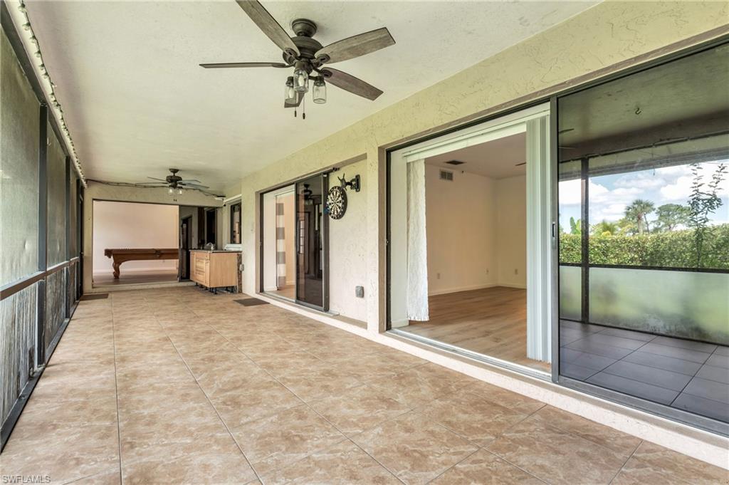 102 Muirfield Circle Naples, FL 34113 - Photo 20 of 43 a view of a hallway with a livingroom