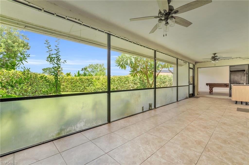 102 Muirfield Circle Naples, FL 34113 - Photo 32 of 43 a view of a room with a large window