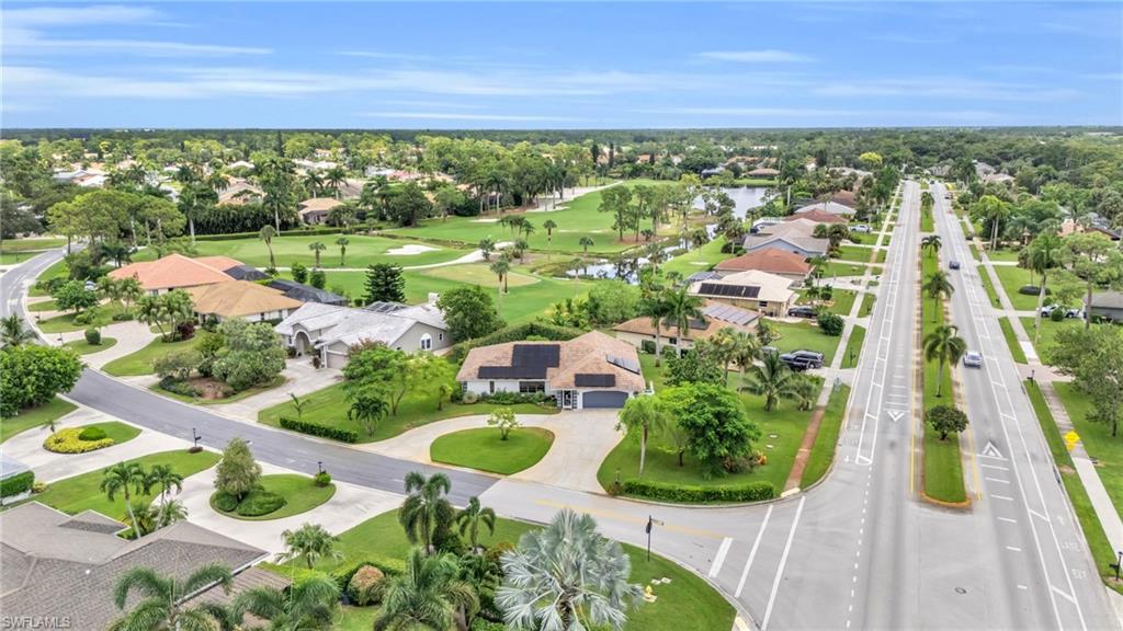 102 Muirfield Circle Naples, FL 34113 - Photo 39 of 43 a view of a lot of trees and houses
