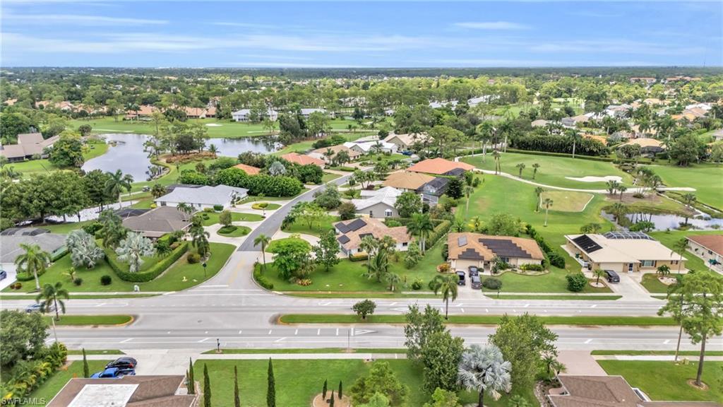 102 Muirfield Circle Naples, FL 34113 - Photo 40 of 43 an aerial view of residential houses with outdoor space and swimming pool