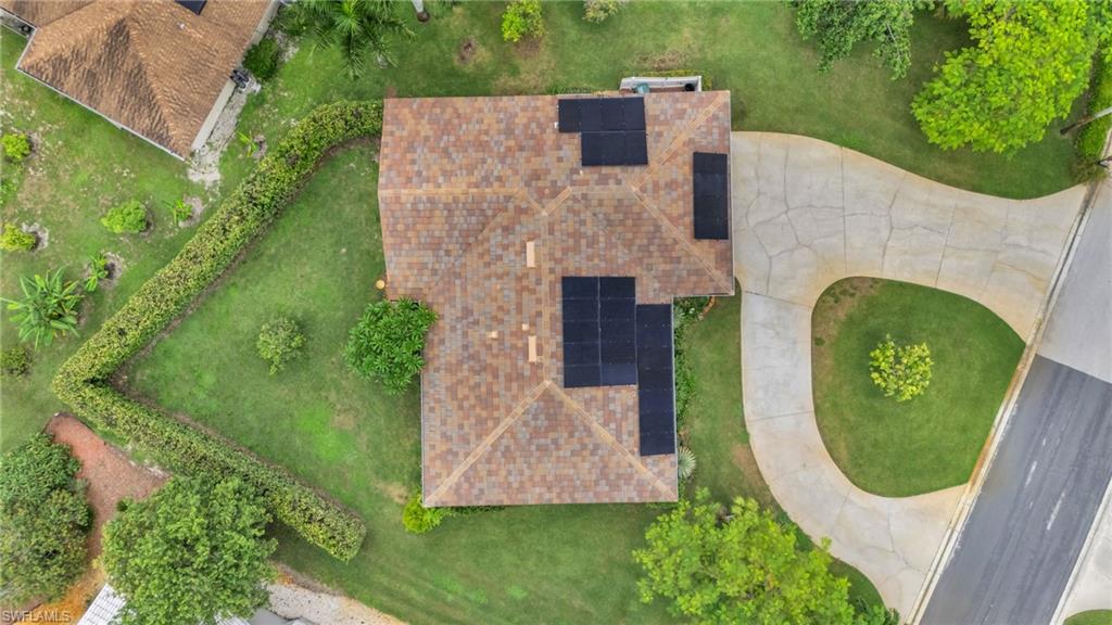 102 Muirfield Circle Naples, FL 34113 - Photo 5 of 43 an aerial view of a house with garden space sitting space and swimming pool