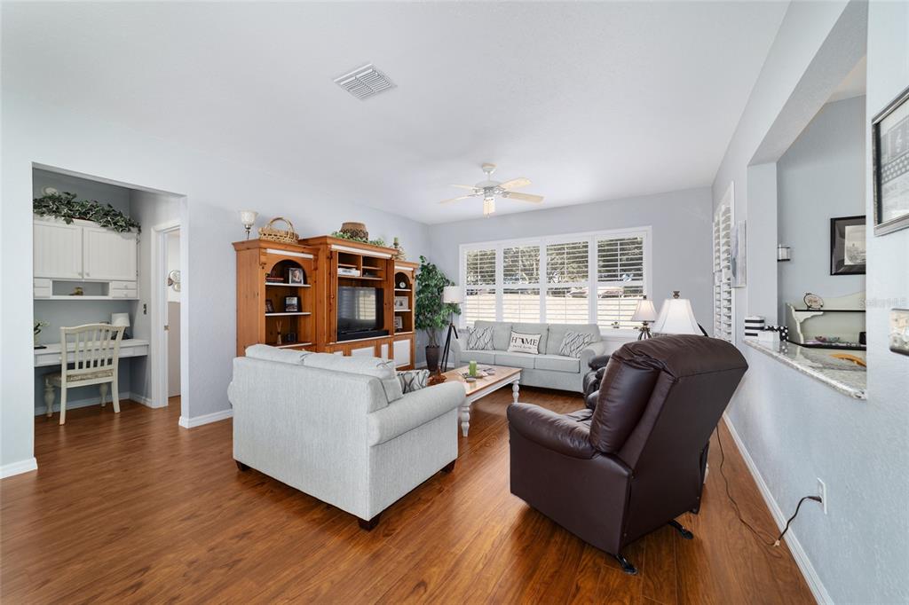 13146 Southeast 93rd Terrace Road Summerfield, FL 34491 - Photo 15 of 63 a living room with furniture and a large window