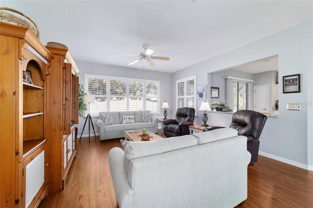 13146 Southeast 93rd Terrace Road Summerfield, FL 34491 - Photo 16 of 63 a living room with furniture fireplace and a window