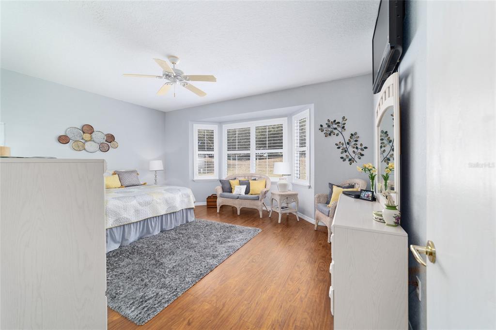 13146 Southeast 93rd Terrace Road Summerfield, FL 34491 - Photo 32 of 63 a living room with furniture and a large window