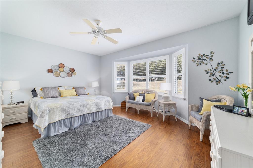 13146 Southeast 93rd Terrace Road Summerfield, FL 34491 - Photo 33 of 63 a bedroom with a bed furniture and a window