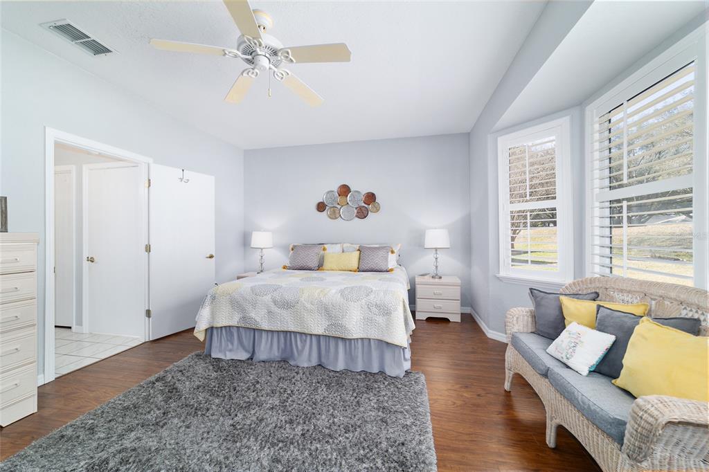 13146 Southeast 93rd Terrace Road Summerfield, FL 34491 - Photo 34 of 63 a bedroom with a bed and a couch