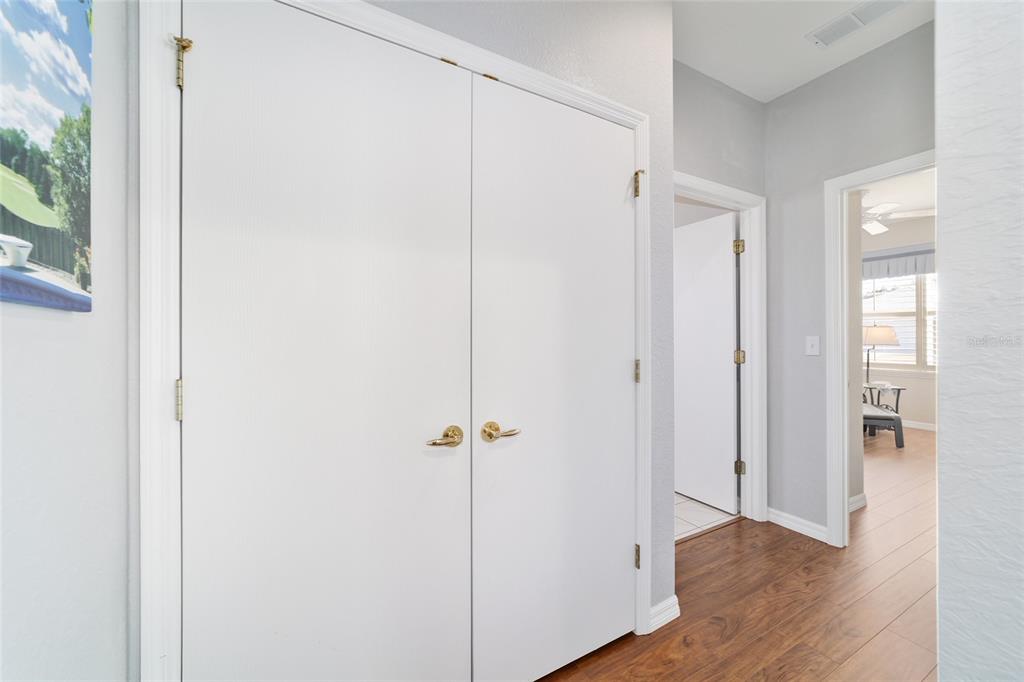13146 Southeast 93rd Terrace Road Summerfield, FL 34491 - Photo 39 of 63 a view of an empty room with wooden floor and a window