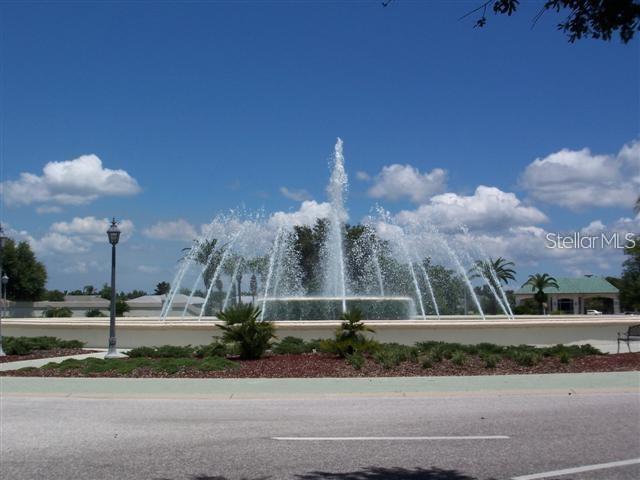 13146 Southeast 93rd Terrace Road Summerfield, FL 34491 - Photo 62 of 63 a view of a fountain in front of a building
