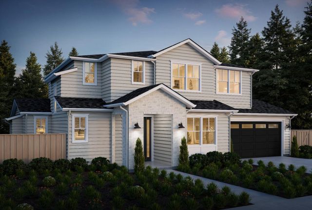 a front view of a house with a yard and green space