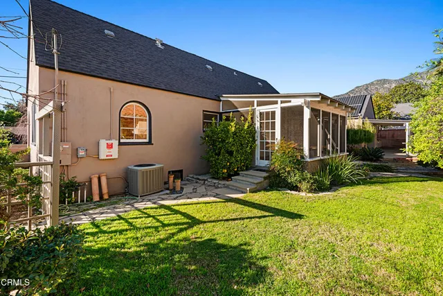 a house view with a garden space