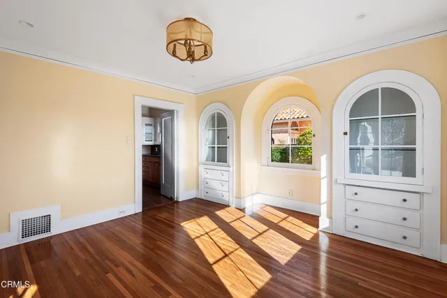 a view of an entryway with wooden floor