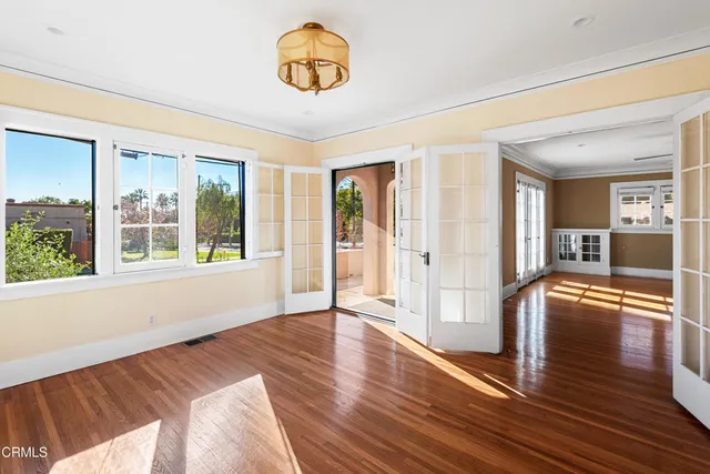 a view of an entryway with wooden floor
