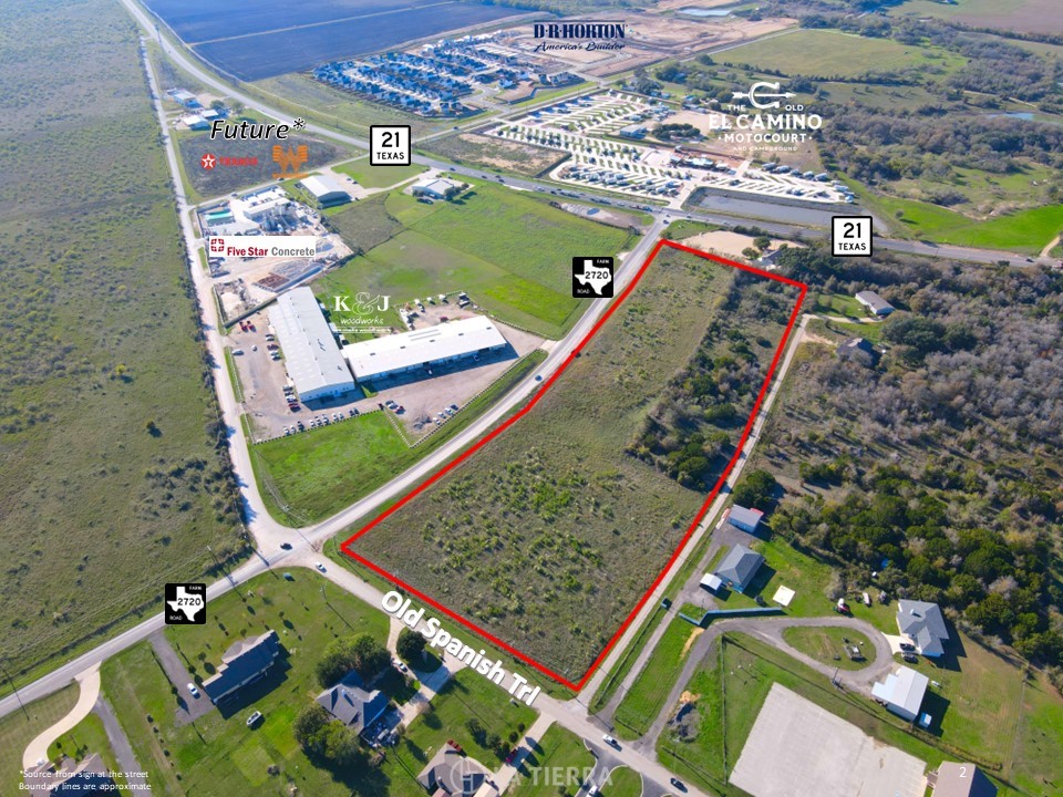 an aerial view of a pool a yard and mountain view in back