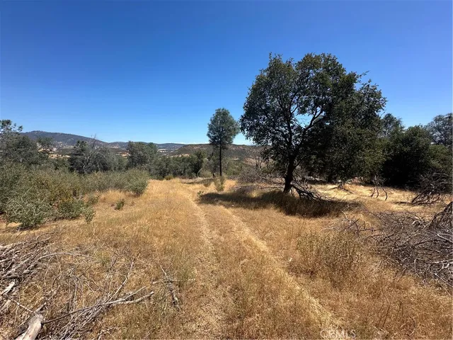 a view of a mountain range in a cloudy sky