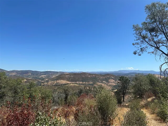 a view of a city with mountains in the background
