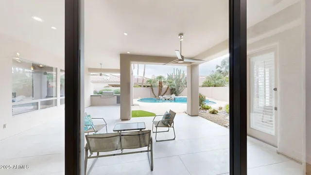 a view of a room with a furniture and floor to ceiling window