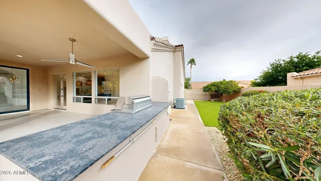 a view of a house with a porch and furniture
