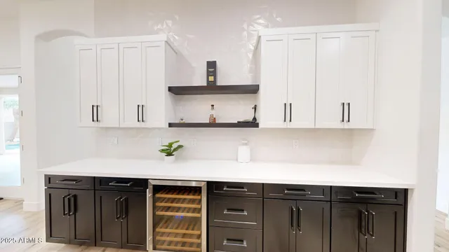 a kitchen with stainless steel appliances a sink and cabinets