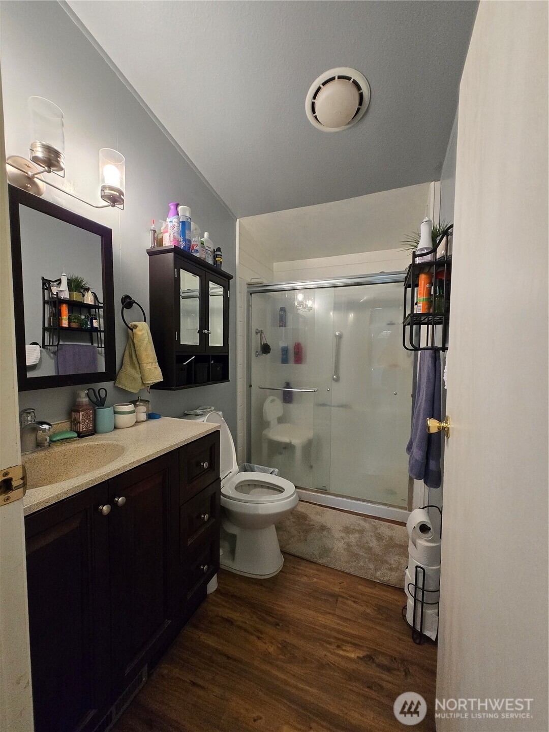 1466 Ferrier Road Winlock, WA 98596 - Photo 17 of 33 a bathroom with a double vanity sink toilet and shower