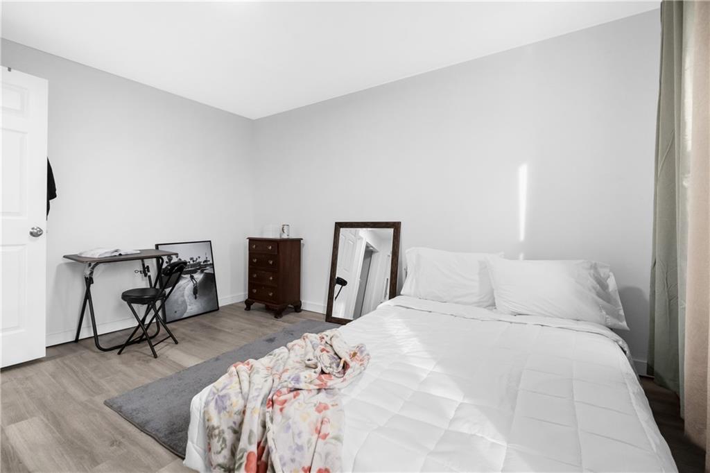 419 Woodward Avenue McKees Rocks, PA 15136 - Photo 23 of 26 a bedroom with a bed a desk and chair