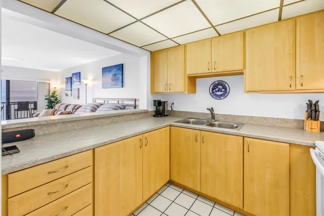 a kitchen with stainless steel appliances granite countertop a sink and a stove