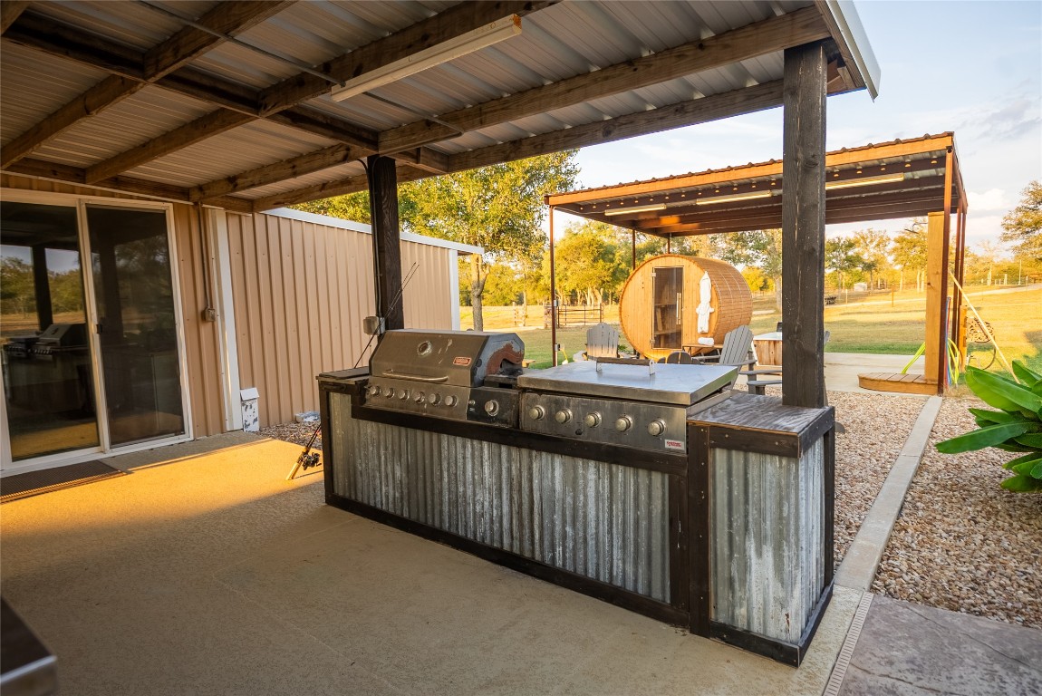 1000 Oil Field Road Lockhart, TX 78644 - Photo 12 of 39 a backyard of a house with table and chairs