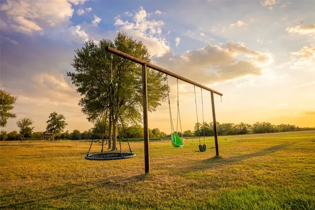 a dining room with kitchen island stainless steel appliances furniture a dining table and chairs