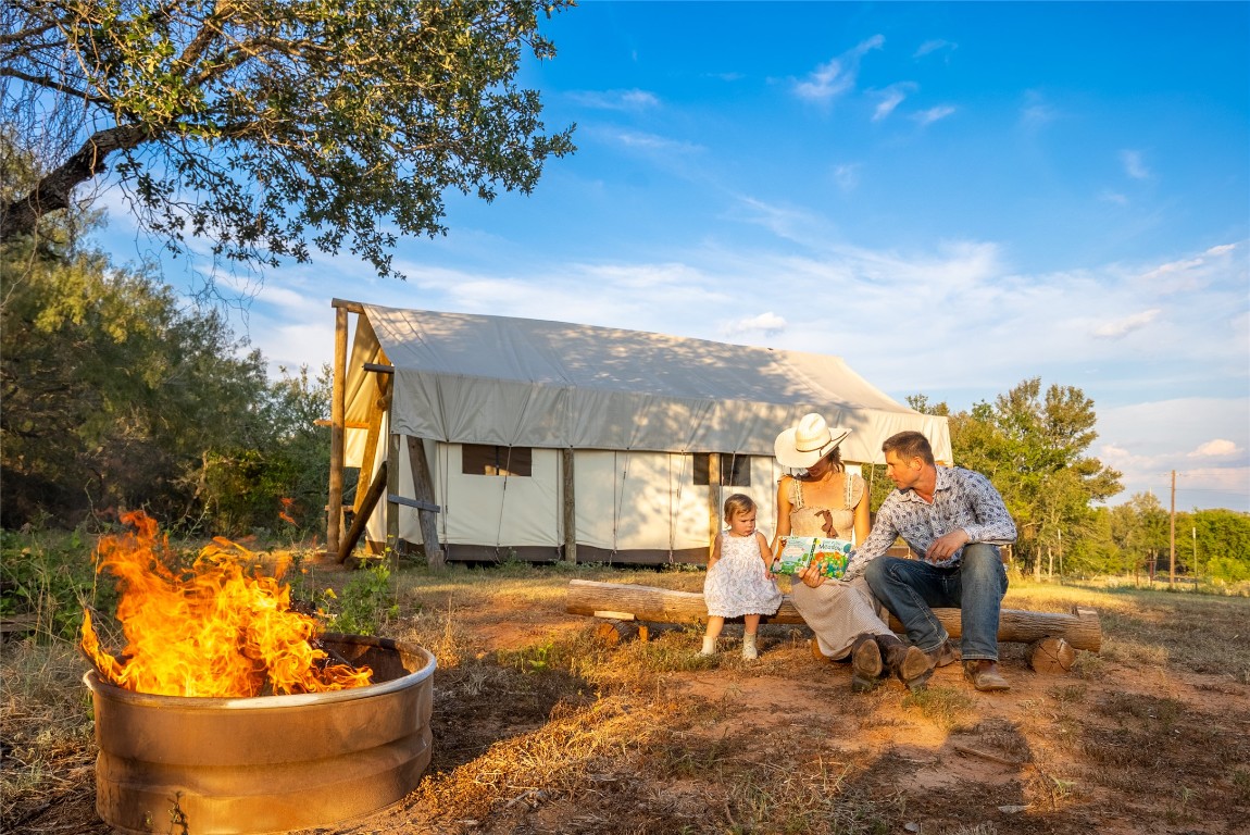 1000 Oil Field Road Lockhart, TX 78644 - Photo 2 of 39 a view of a backyard with plants and a patio